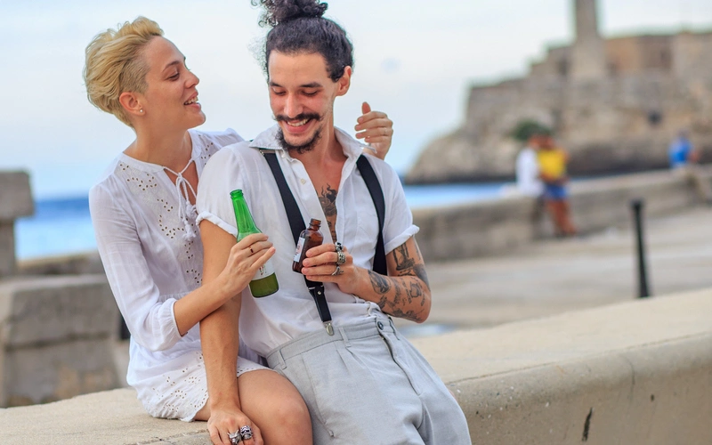 Couple enjoying the reopening in Havana, Matanzas and Cienfuegos on the Malecon in Havana