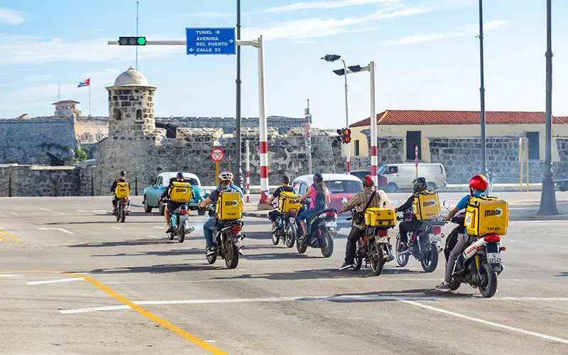 Motorcycles with Mandao Backpacks on the street in front of the Morro in Havana.